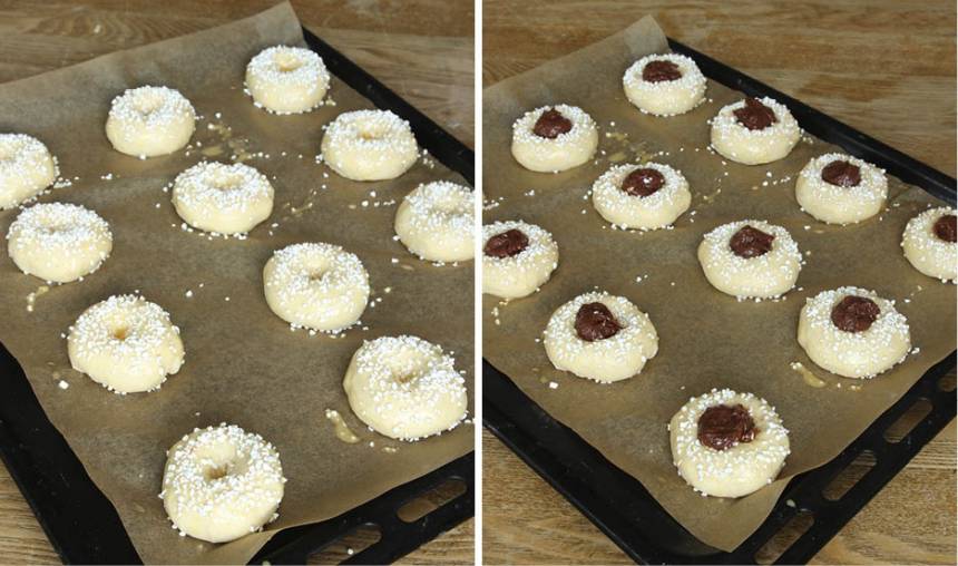4. Pensla bullarna med ägg och strö över pärlsocker. Tryck till hålet igen om det jäst ihop och lägg en klick Nutellafyllning i varje hål.