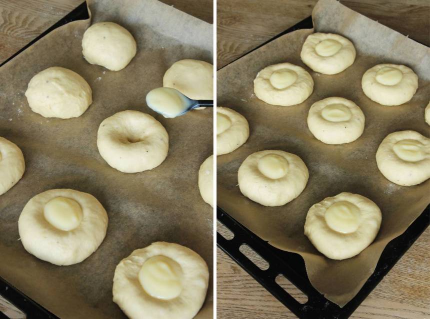 5. Gör en grop med pekfingret i mitten på bullarna . Fyll den med marsankräm. Låt dem jäsa i ca 30 min. Sätt ugnen på 250 grader.